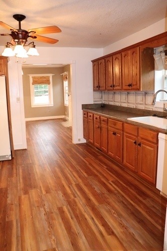 209 Church Street Dover, TN 37058 - Photo 5 of 16 a kitchen with stainless steel appliances granite countertop a stove a sink and a refrigerator