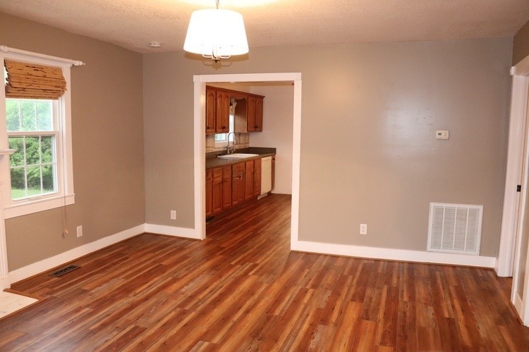 209 Church Street Dover, TN 37058 - Photo 6 of 16 wooden floor in an empty room with a window