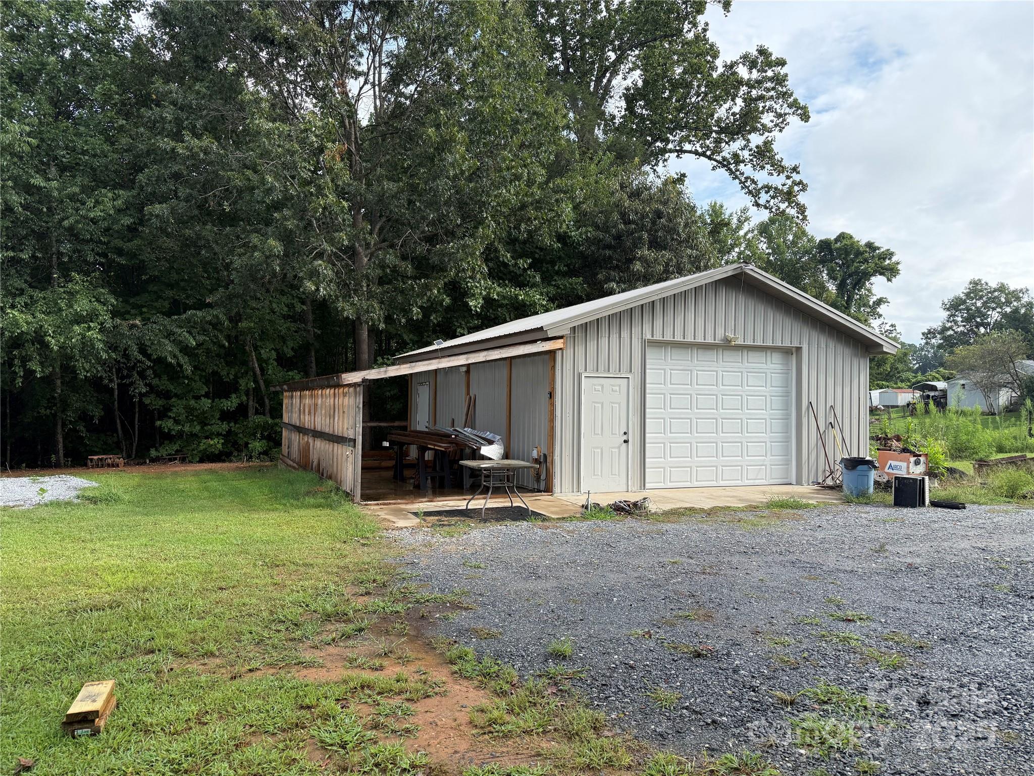 637 Ridge Road Marion, NC 28752 - Photo 13 of 18 a view of a house with backyard and trees