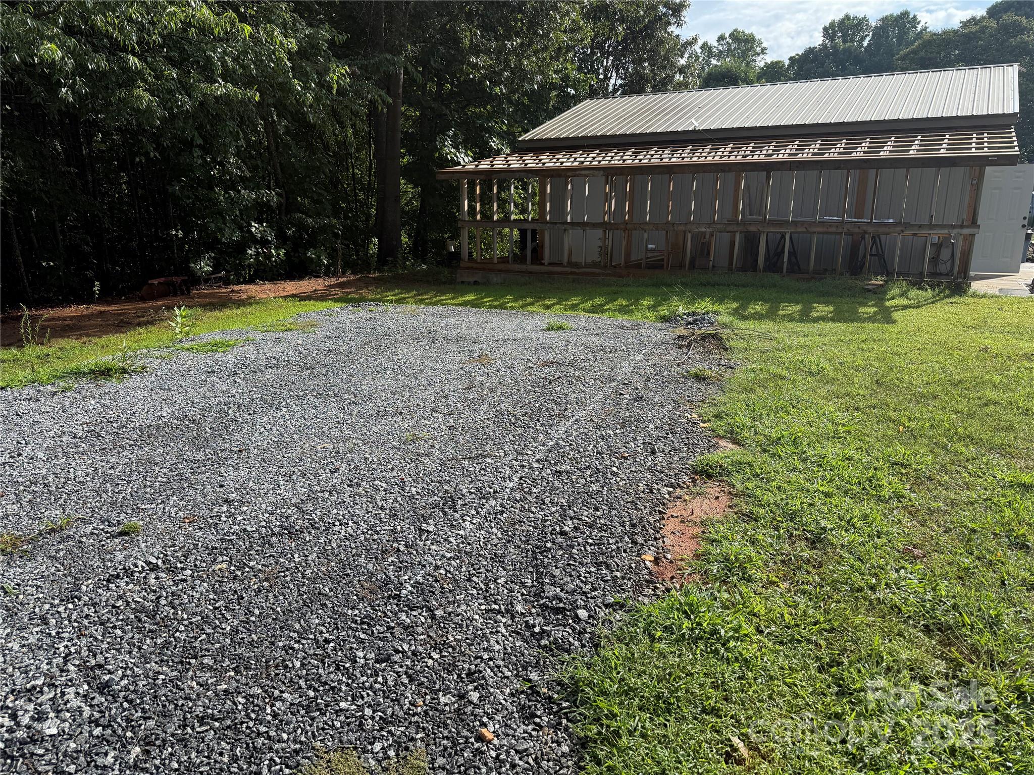 637 Ridge Road Marion, NC 28752 - Photo 14 of 18 a view of a house with backyard and swing
