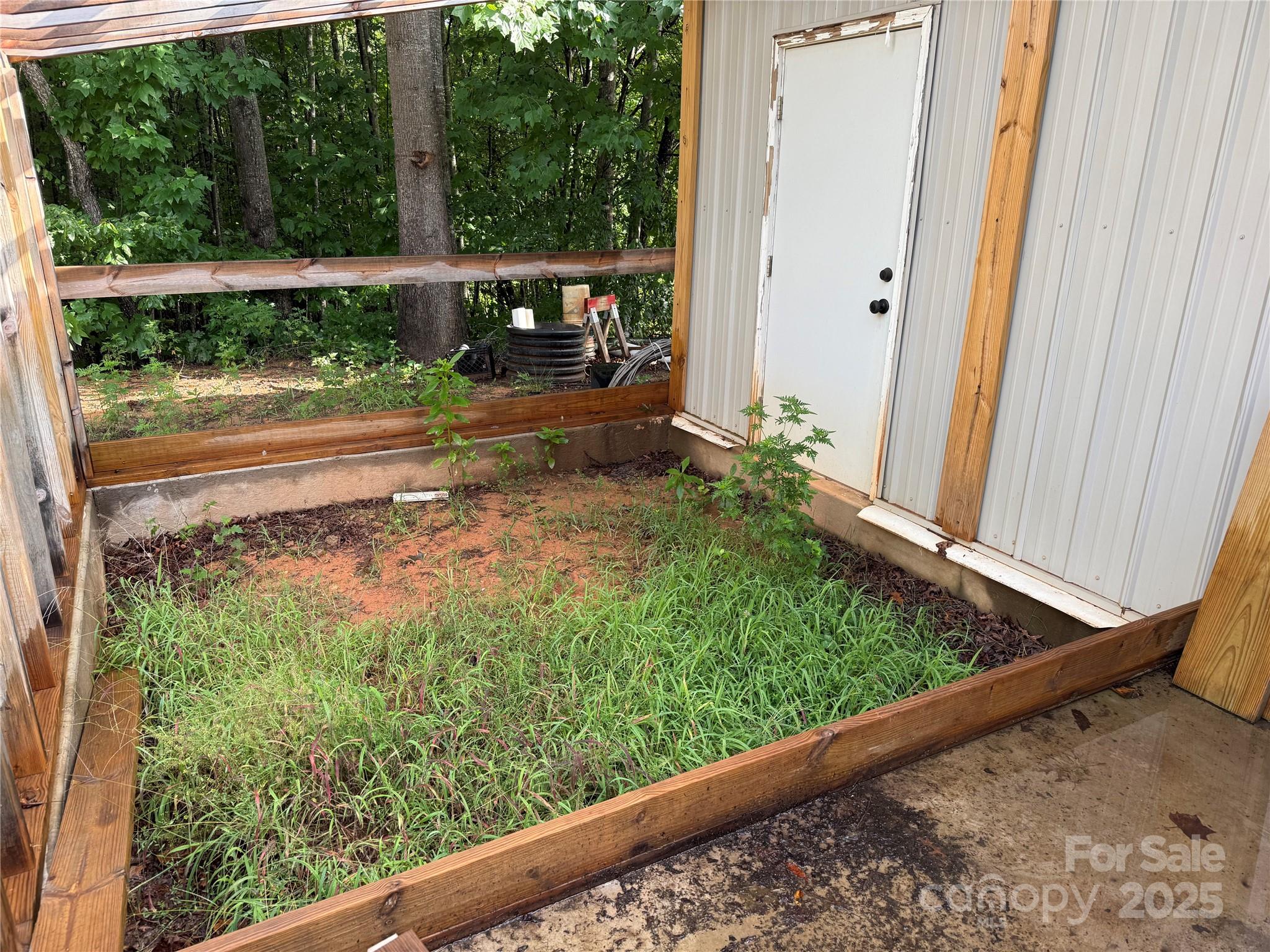 637 Ridge Road Marion, NC 28752 - Photo 16 of 18 a view of a small yard from a window