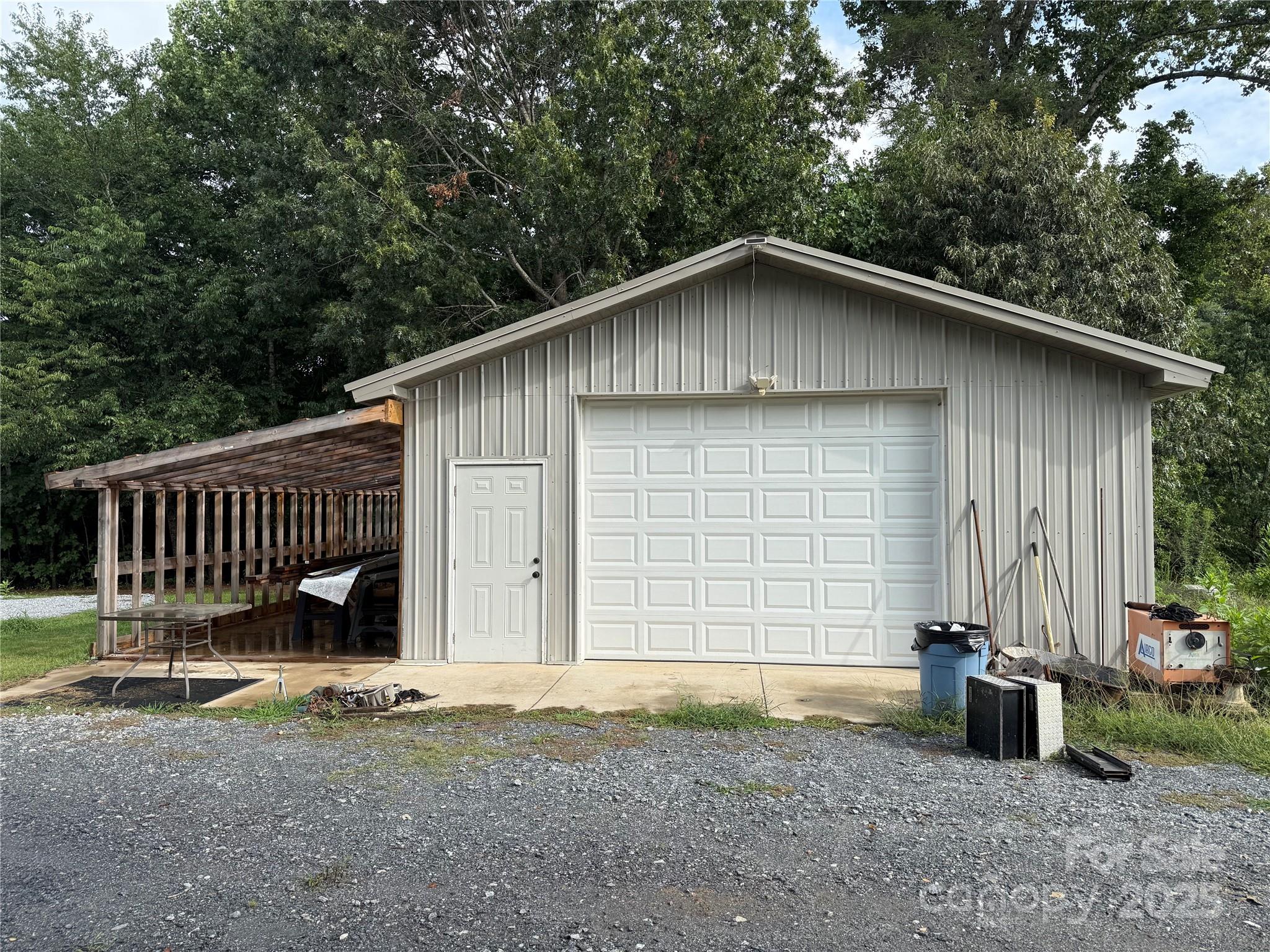 637 Ridge Road Marion, NC 28752 - Photo 4 of 18 a view of backyard with wooden fence and deck