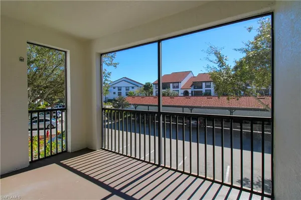a view of a balcony with wooden floor