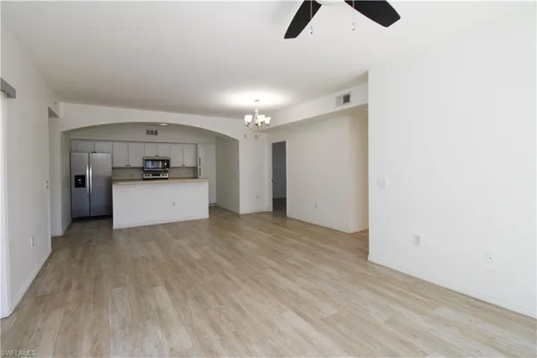a view of a kitchen with a sink dishwasher and a refrigerator
