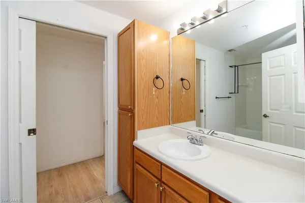 a bathroom with a sink and a mirror