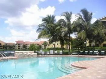 a view of swimming pool with outdoor seating