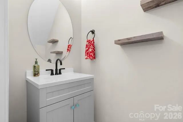 a bathroom with a sink and mirror