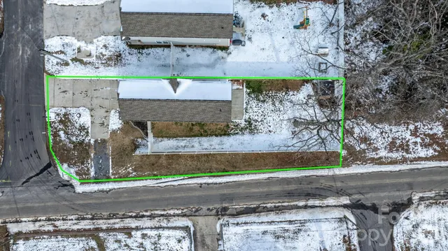 an aerial view of a yard with an outdoor space