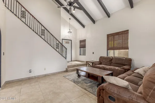 a living room with furniture and a rug