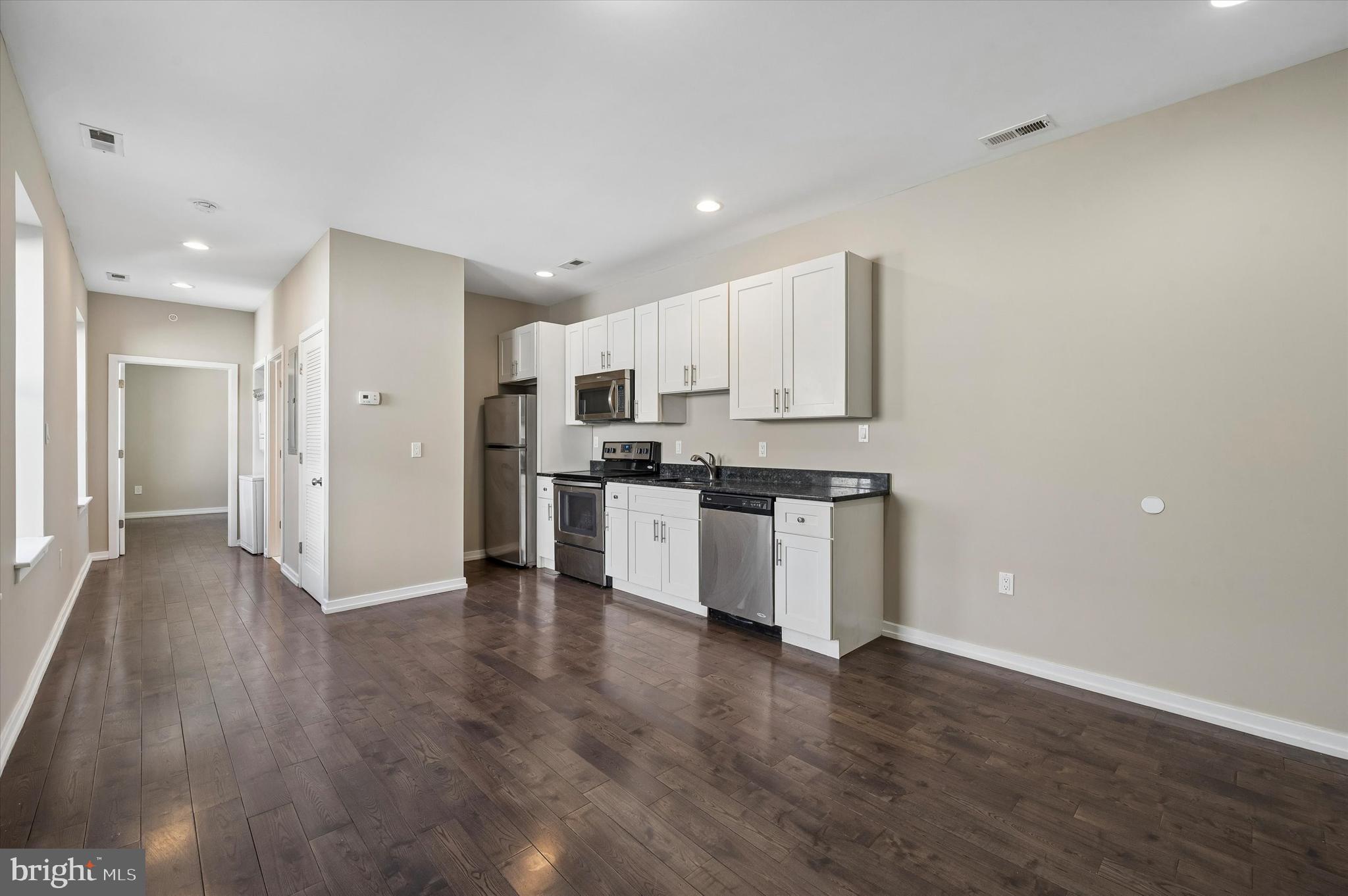 617 South 2nd Street, Unit 3R Philadelphia, PA 19147 - Photo 2 of 19 a view of kitchen with granite countertop stainless steel appliances counter space and wooden floor