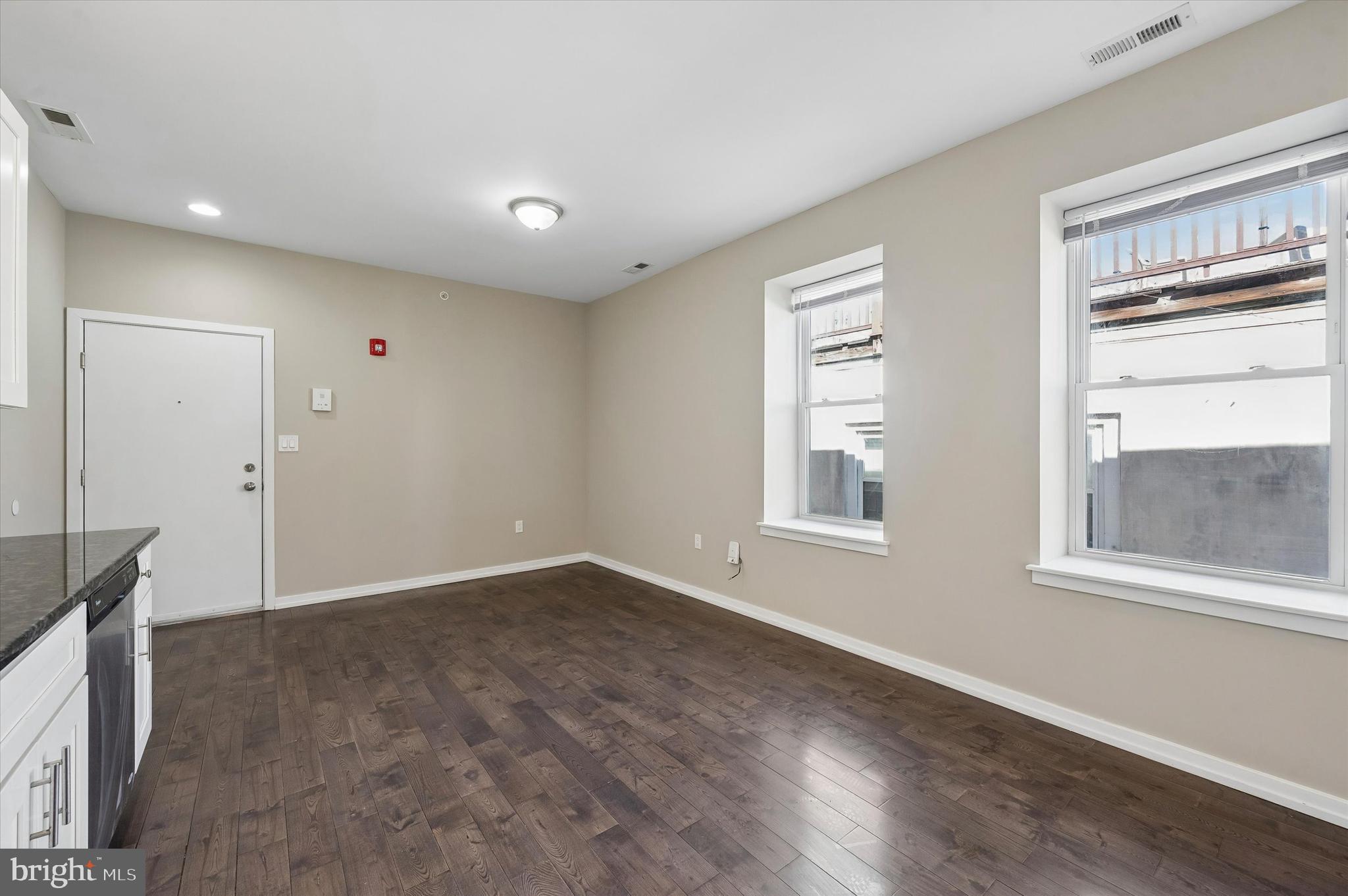 617 South 2nd Street, Unit 3R Philadelphia, PA 19147 - Photo 6 of 19 a view of an empty room with wooden floor and a window