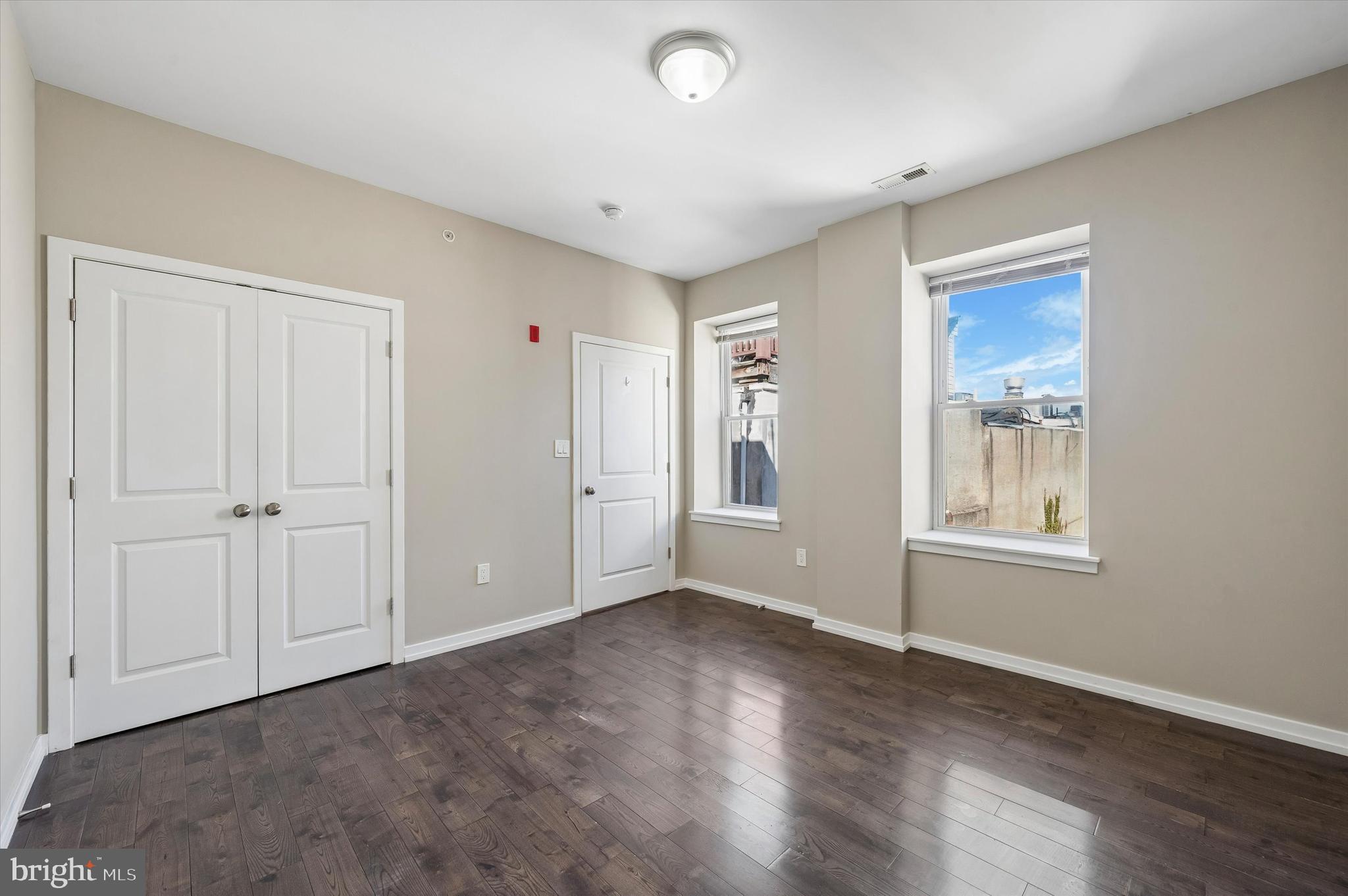 617 South 2nd Street, Unit 3R Philadelphia, PA 19147 - Photo 9 of 19 a view of an empty room with wooden floor and a window