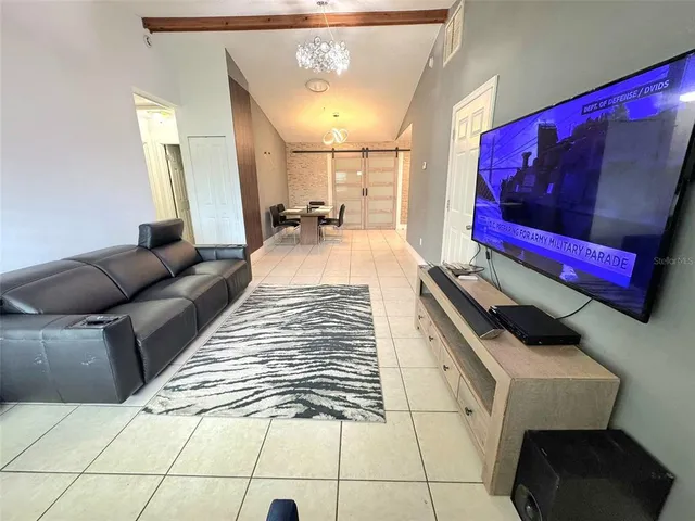 a living room with a bed and a couch