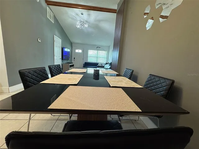 a view of a storage and utility room with washer and dryer