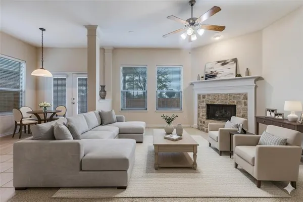 a living room with furniture and a fireplace