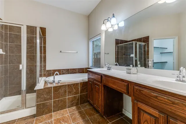 an empty room with chandelier fan