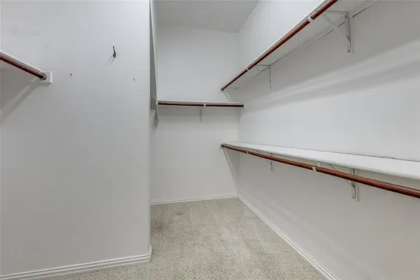 a bathroom with a tub a sink and a mirror