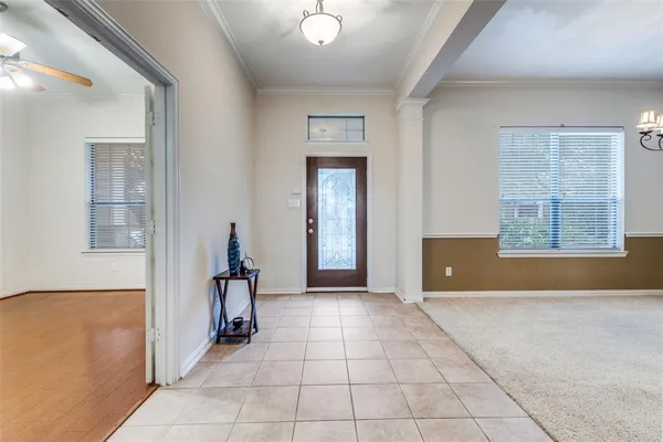 a view of a room with a window and a chandelier