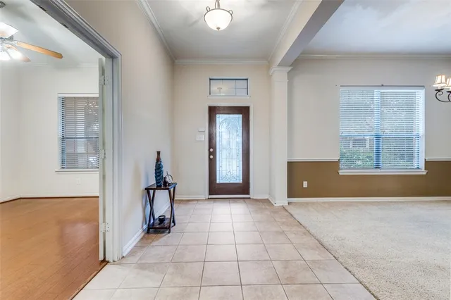 a view of a room with a window and a chandelier