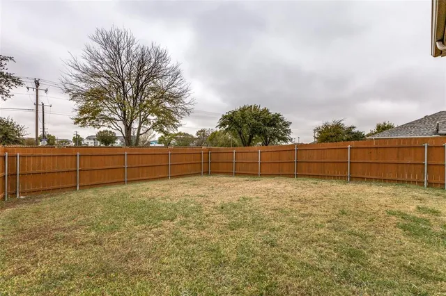 a view of backyard with green space