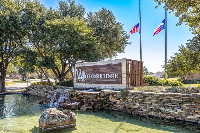 front view of a brick house with a yard
