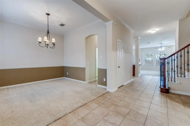 a view of a chandelier in a room with a chandelier
