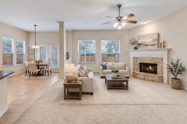 a living room with furniture and a fireplace