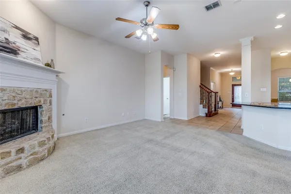 a view of an empty room with a fireplace