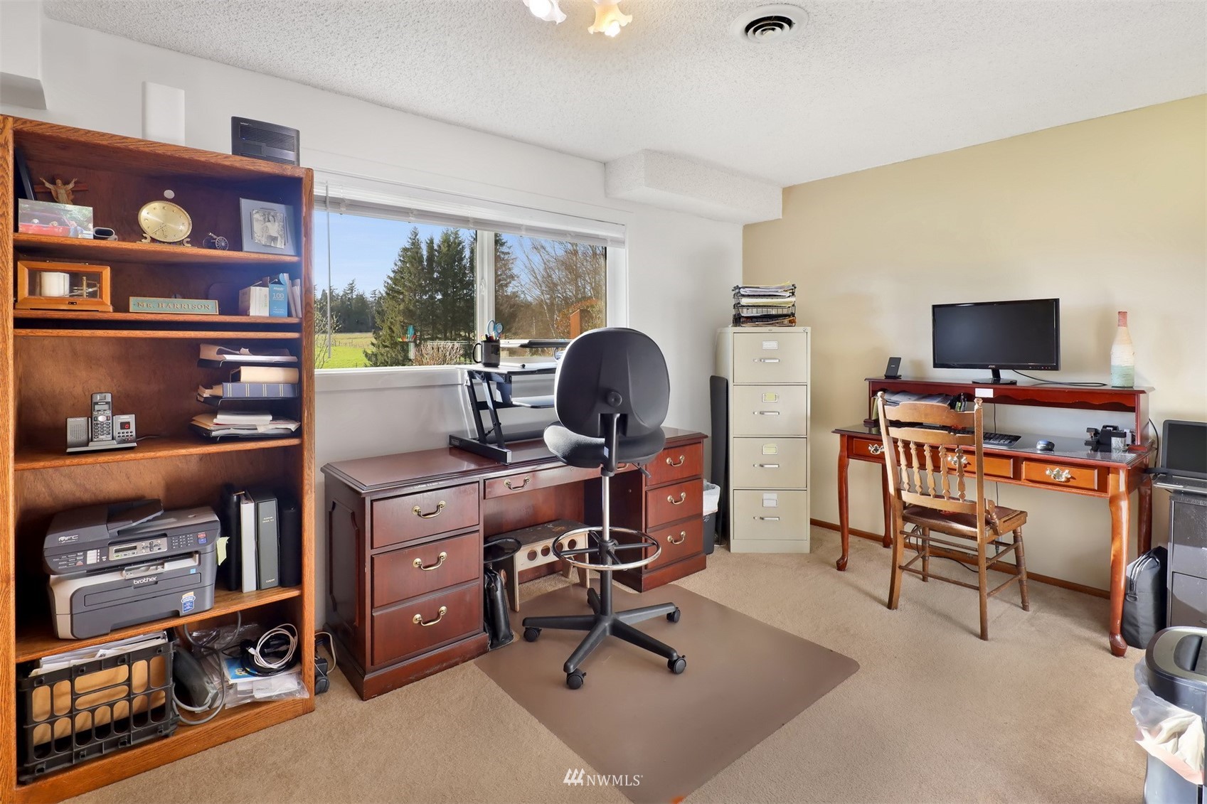 5397 Olson Road Ferndale, WA 98248 - Photo 14 of 40 a view of a workspace with furniture and a bookshelf