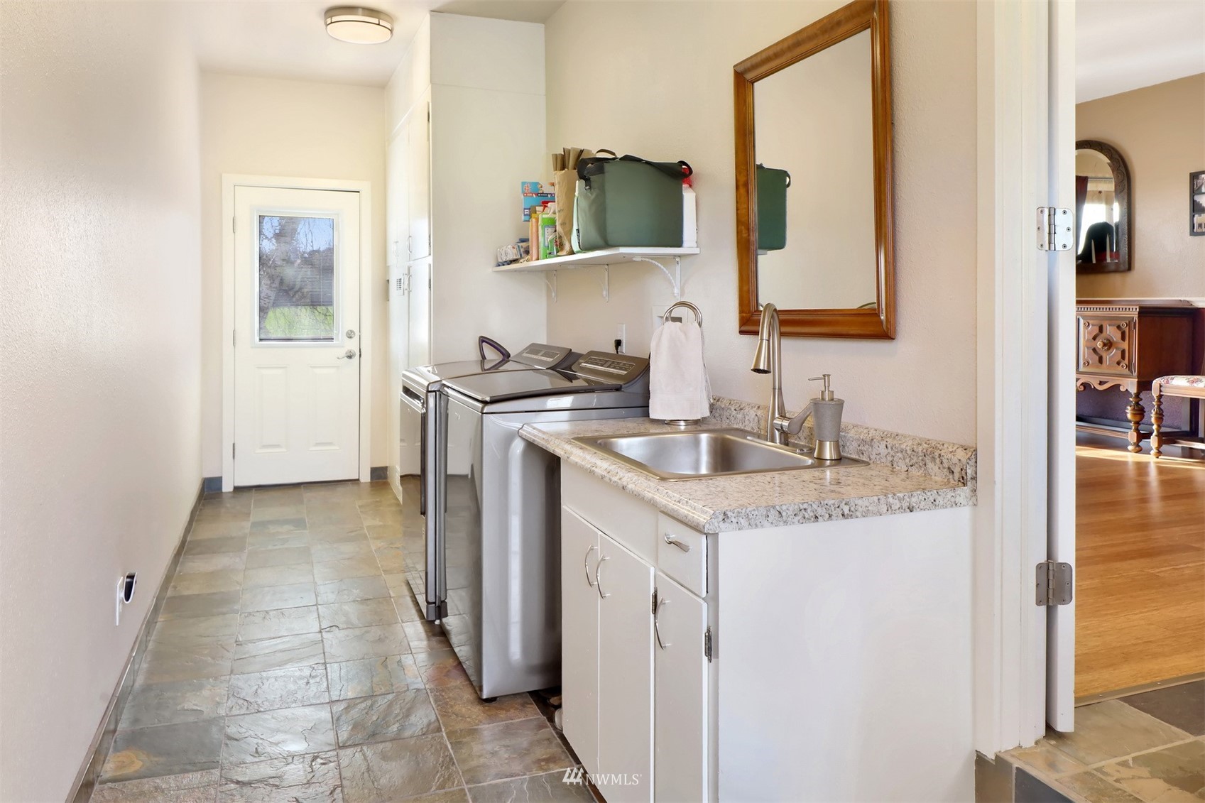5397 Olson Road Ferndale, WA 98248 - Photo 15 of 40 a bathroom with a granite countertop sink and a mirror