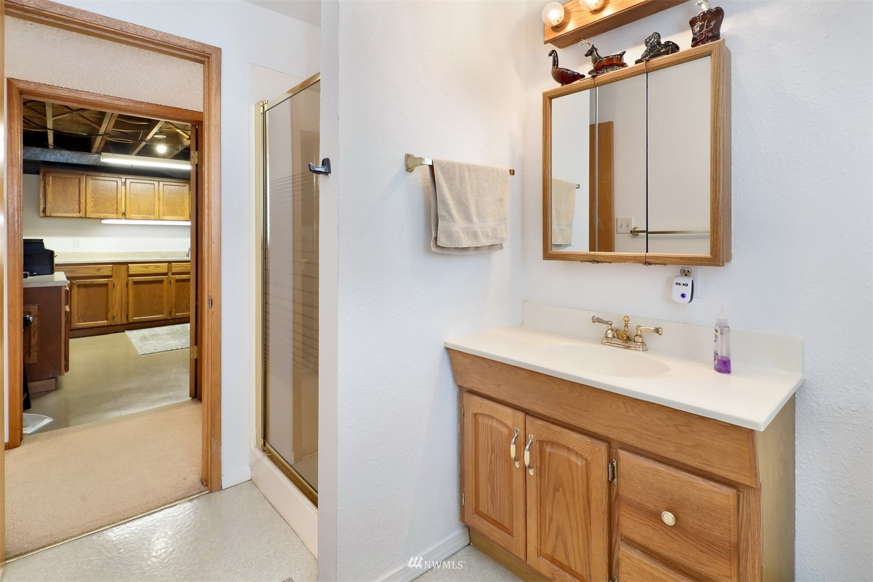 5397 Olson Road Ferndale, WA 98248 - Photo 21 of 40 a bathroom with a sink vanity and mirror