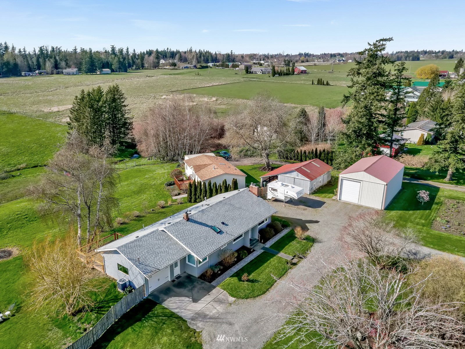 5397 Olson Road Ferndale, WA 98248 - Photo 3 of 40 an aerial view of a house with green yard and outdoor seating