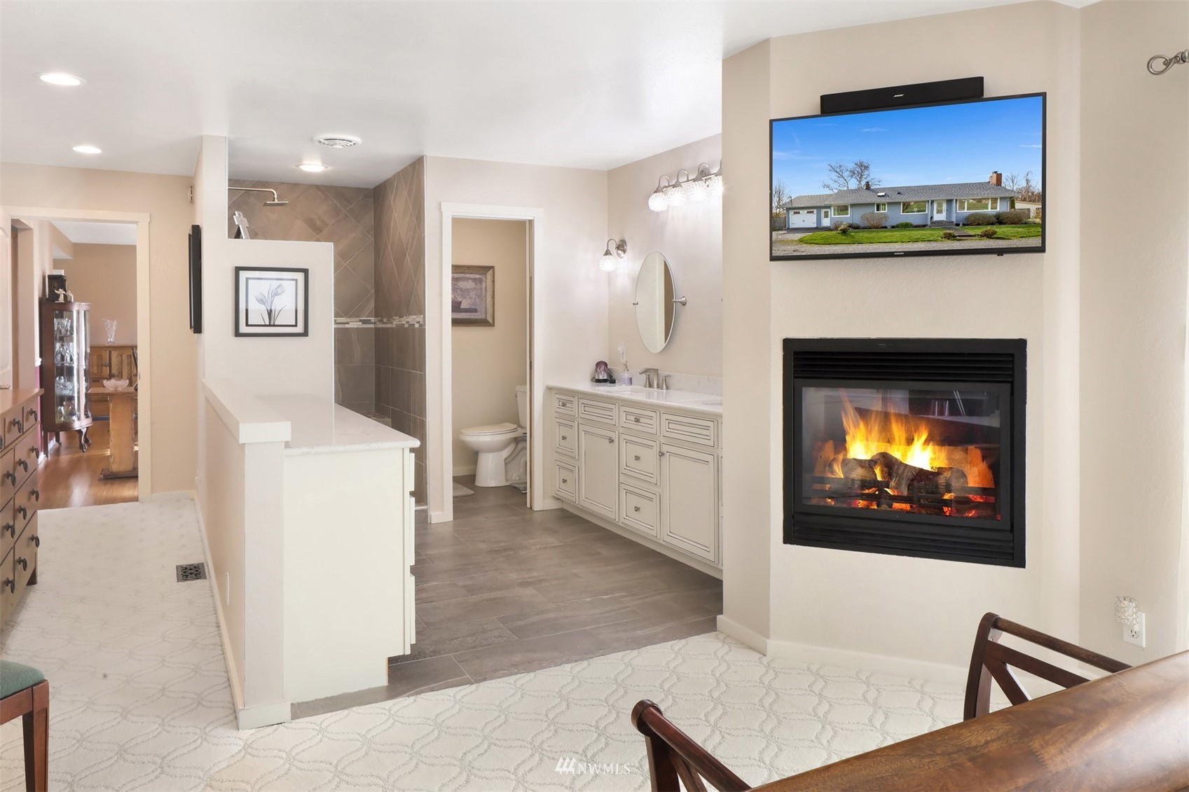 5397 Olson Road Ferndale, WA 98248 - Photo 10 of 40 a living room with furniture a fireplace and a flat screen tv