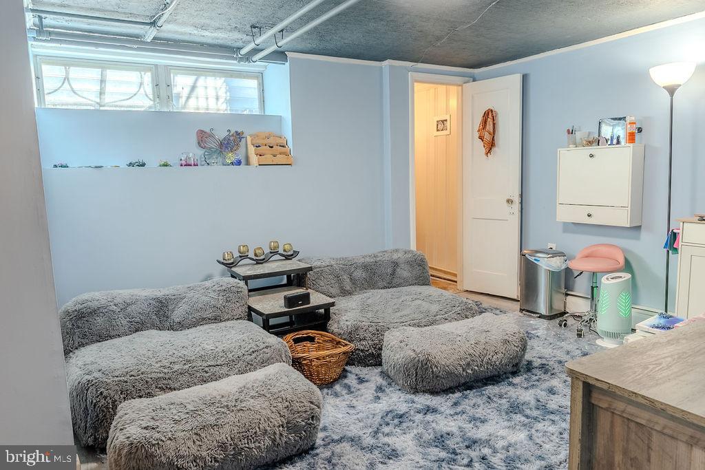 739 Fairfax Road Drexel Hill, PA 19026 - Photo 14 of 18 a living room with furniture and a table