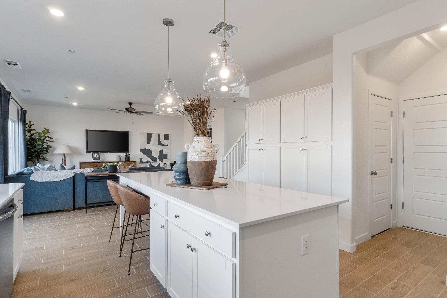 1059 Springtime Avenue Clovis, CA 93619 - Photo 13 of 32 a kitchen with stainless steel appliances kitchen island granite countertop a sink and a refrigerator