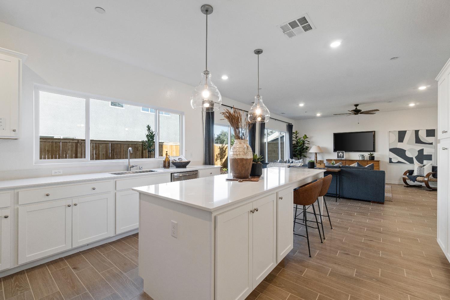 1059 Springtime Avenue Clovis, CA 93619 - Photo 14 of 32 a kitchen with sink and center island