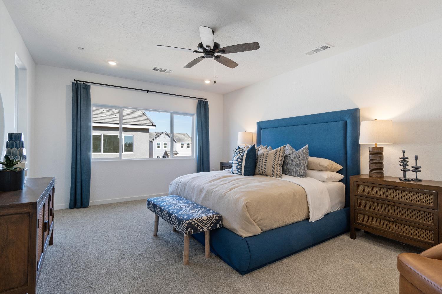 1059 Springtime Avenue Clovis, CA 93619 - Photo 19 of 32 a spacious bedroom with a bed and a window