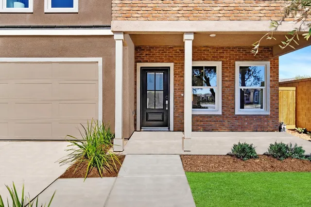 a front view of a house having yard