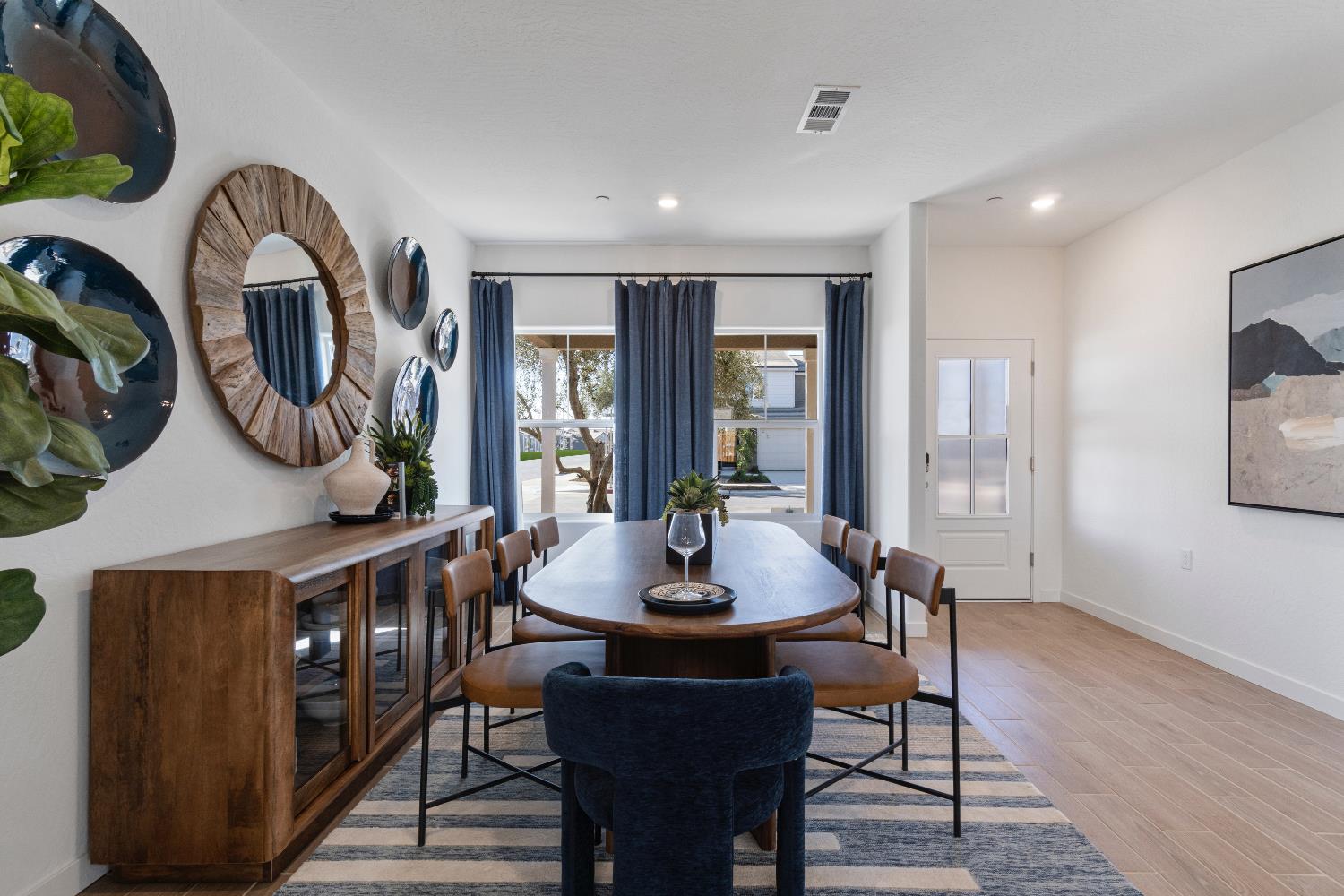 1059 Springtime Avenue Clovis, CA 93619 - Photo 6 of 32 a view of a dining room with furniture window and wooden floor