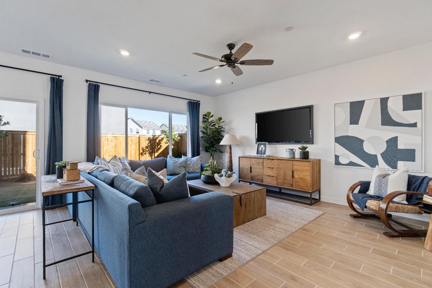 1059 Springtime Avenue Clovis, CA 93619 - Photo 7 of 32 a living room with furniture and a flat screen tv