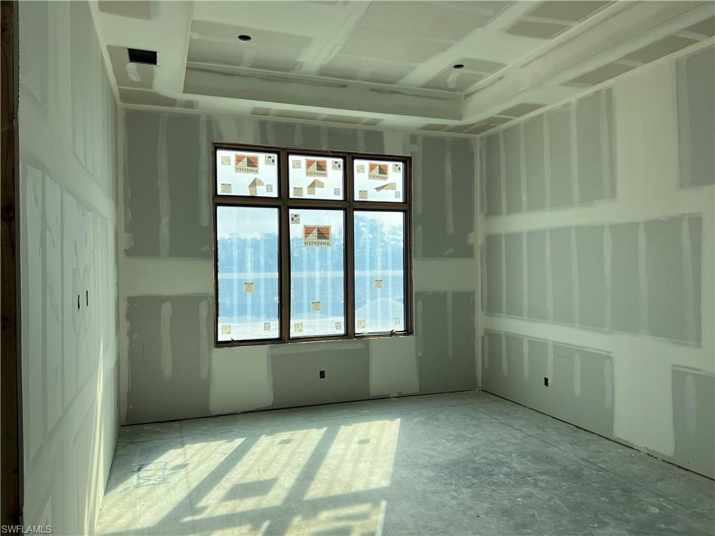 944 Chimney Rock Road Naples, FL 34120 - Photo 10 of 15 a view of an empty room with a window
