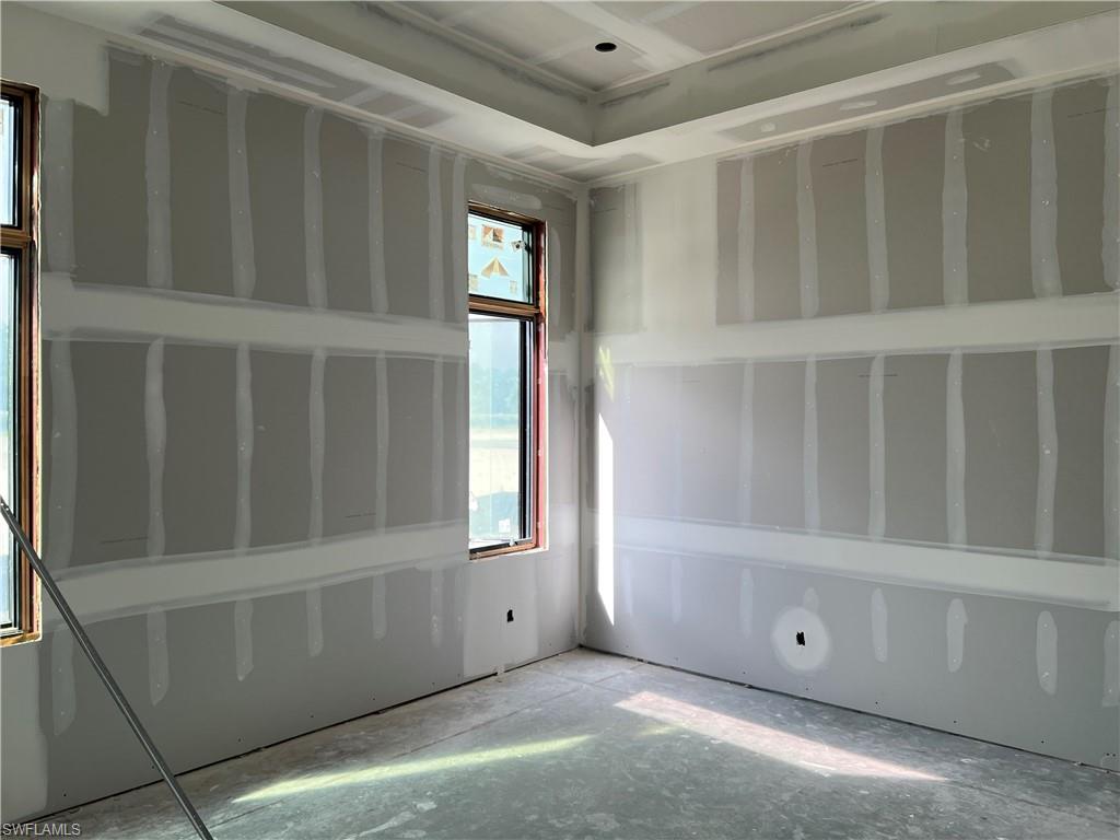 944 Chimney Rock Road Naples, FL 34120 - Photo 11 of 15 a view of an empty room with a window