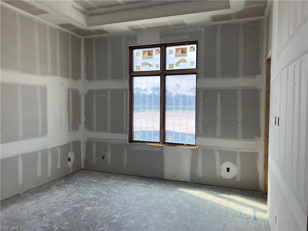 944 Chimney Rock Road Naples, FL 34120 - Photo 12 of 15 an empty room with windows