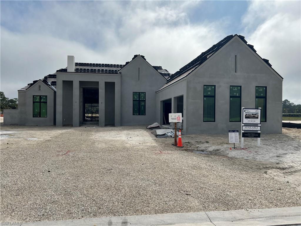 944 Chimney Rock Road Naples, FL 34120 - Photo 2 of 15 a view of a house with backyard and chairs