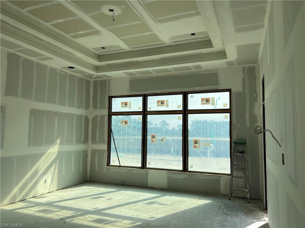 944 Chimney Rock Road Naples, FL 34120 - Photo 7 of 15 a view of an empty room with a window