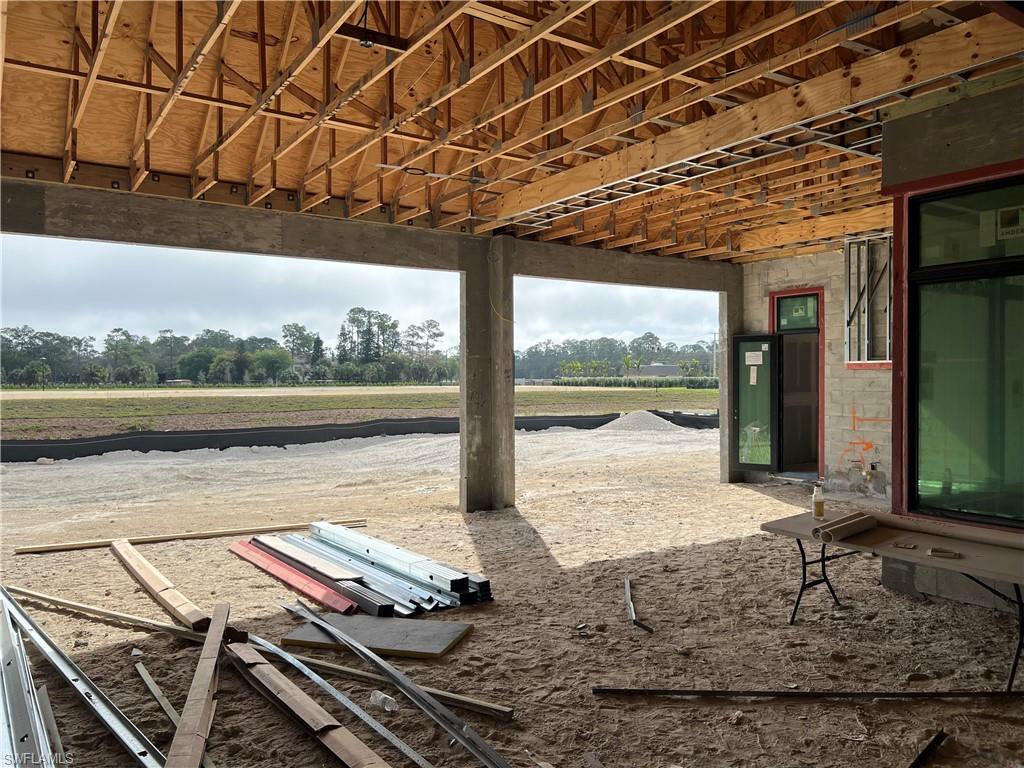 944 Chimney Rock Road Naples, FL 34120 - Photo 9 of 15 a view of a swimming pool with a patio