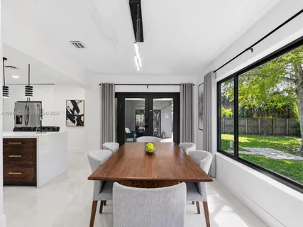 a view of a kitchen with furniture and window
