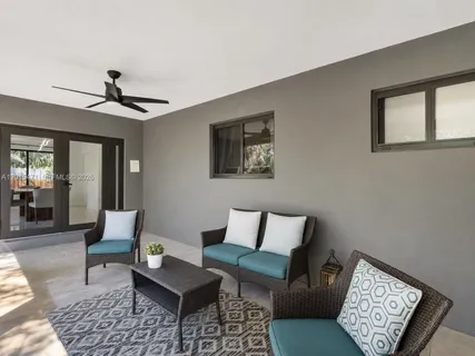 a living room with furniture and a window