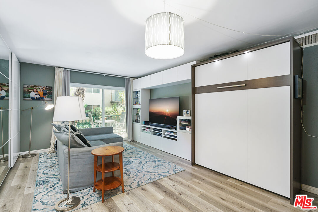 5460 White Oak Avenue, Unit A122 Encino, CA 91316 - Photo 4 of 19 a living room with furniture and a flat screen tv