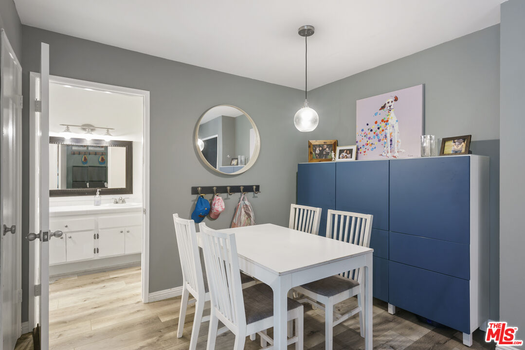 5460 White Oak Avenue, Unit A122 Encino, CA 91316 - Photo 10 of 19 a view of a dining room and a wooden floor